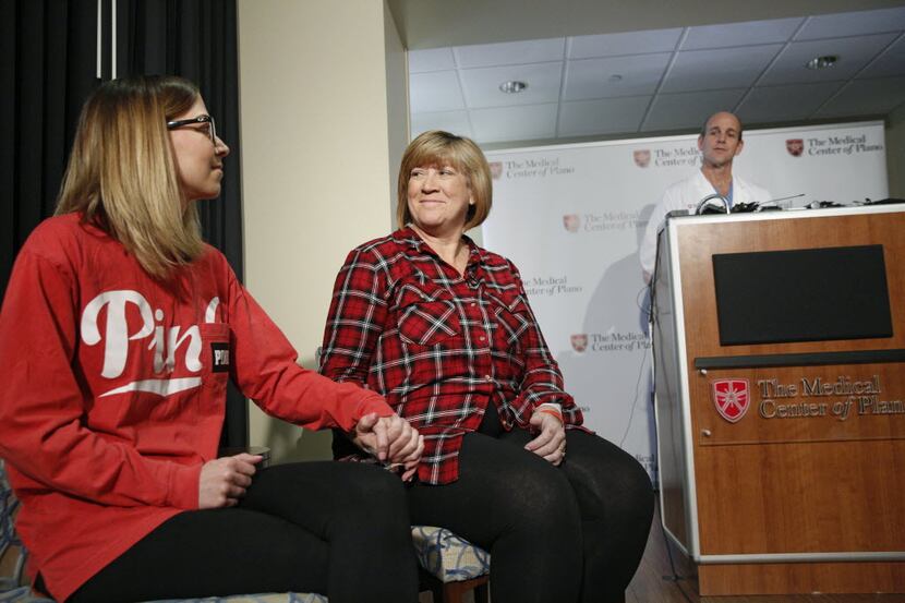 Kelley McKissack held the hand of her mother Tracey Thompson, who carried and delivered...