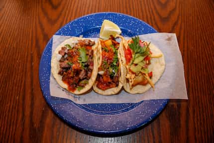 A trio of tacos at Revolver Taco Lounge were photographed June 24, 2021, just after the...
