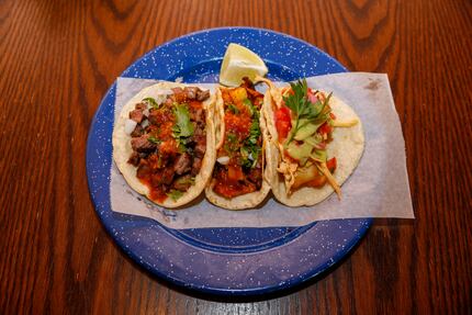 A trio of tacos at Revolver Taco Lounge were photographed June 24, 2021, just after the...