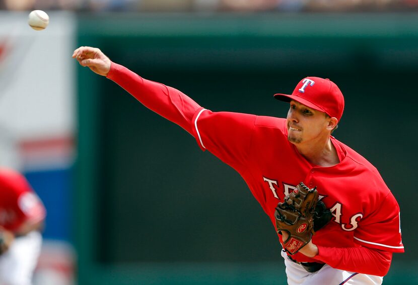 Texas Rangers starting pitcher Tanner Scheppers (52) pitches during the first inning in a...