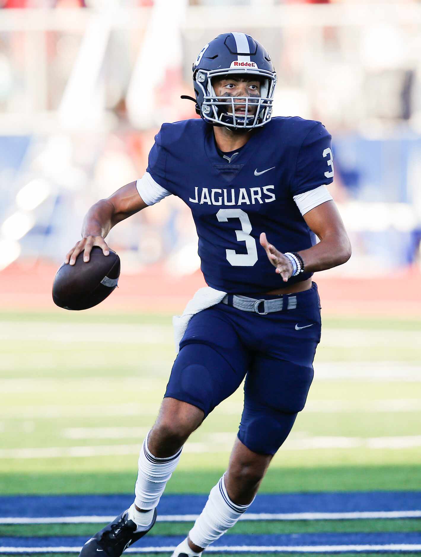 Flower Mound senior quarterback Nick Evers (3) looks for a receiver during the first half of...