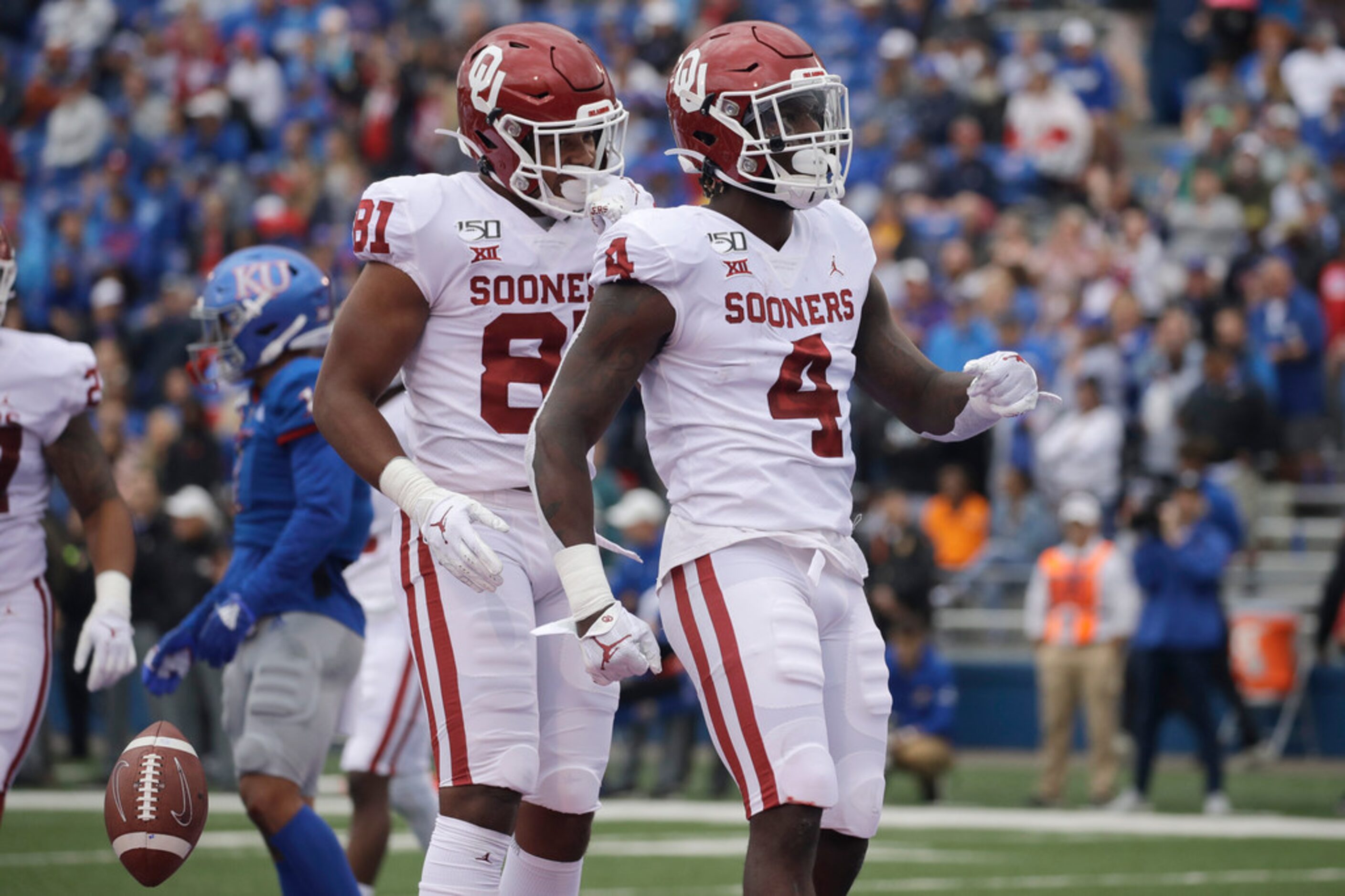 Oklahoma running back Trey Sermon (4) celebrates in the end zone after scoring a touchdown...