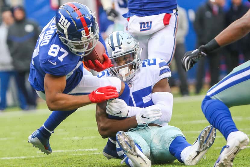 New York Giants wide receiver Sterling Shepard (87) gets stopped by Dallas Cowboys free...