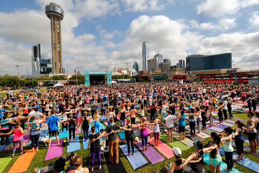 Yoga enthusiasts got to know their neighbors before starting their Wanderlust yoga and...