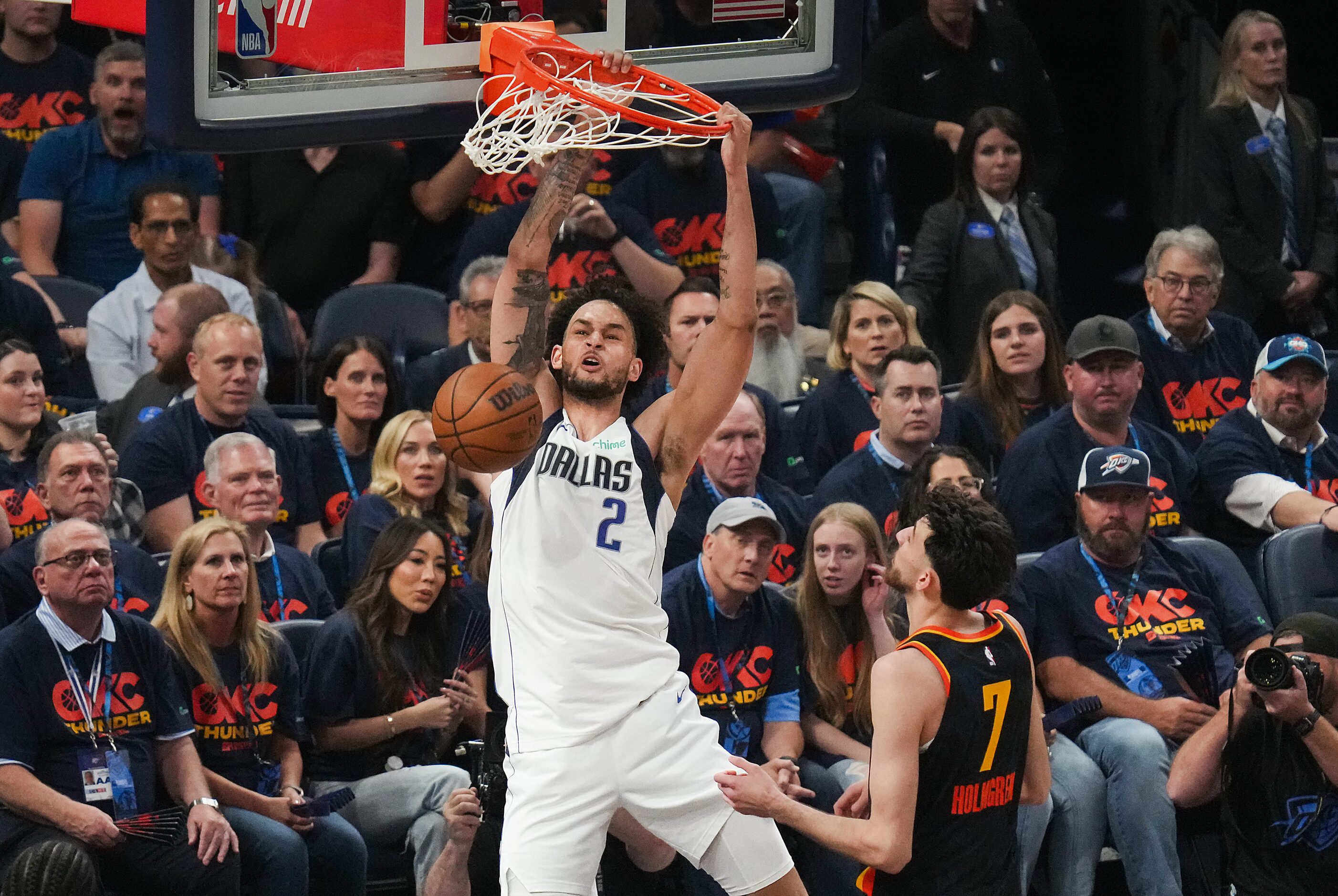 Dallas Mavericks center Dereck Lively II (2) dunks the ball past Oklahoma City Thunder...