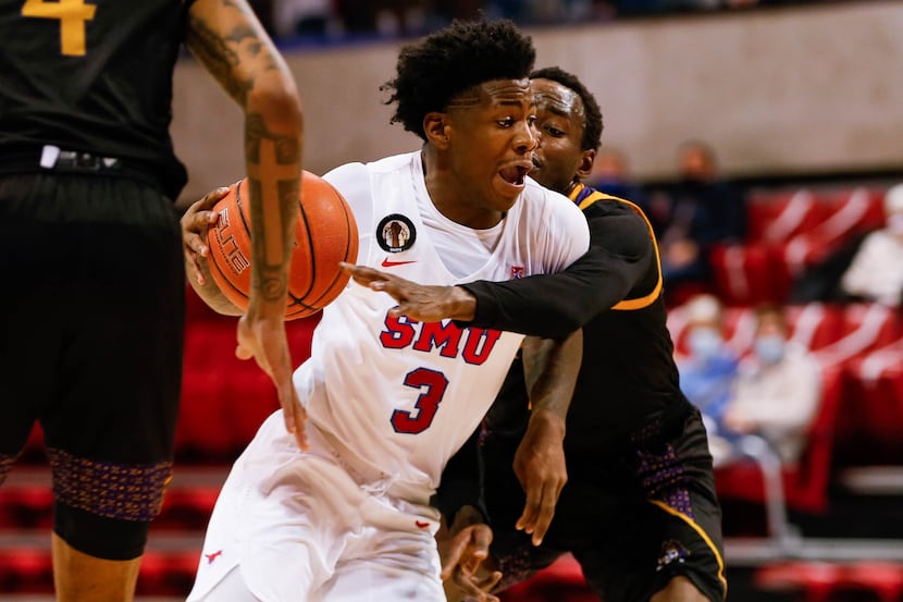SMU's guard Kendric Davis (3) is up against the East Carolina defense during the second half...