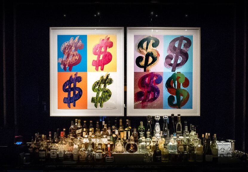 Andy Warhol's "Dollar Sign (Quad)" screen prints are part of the art collection on display...