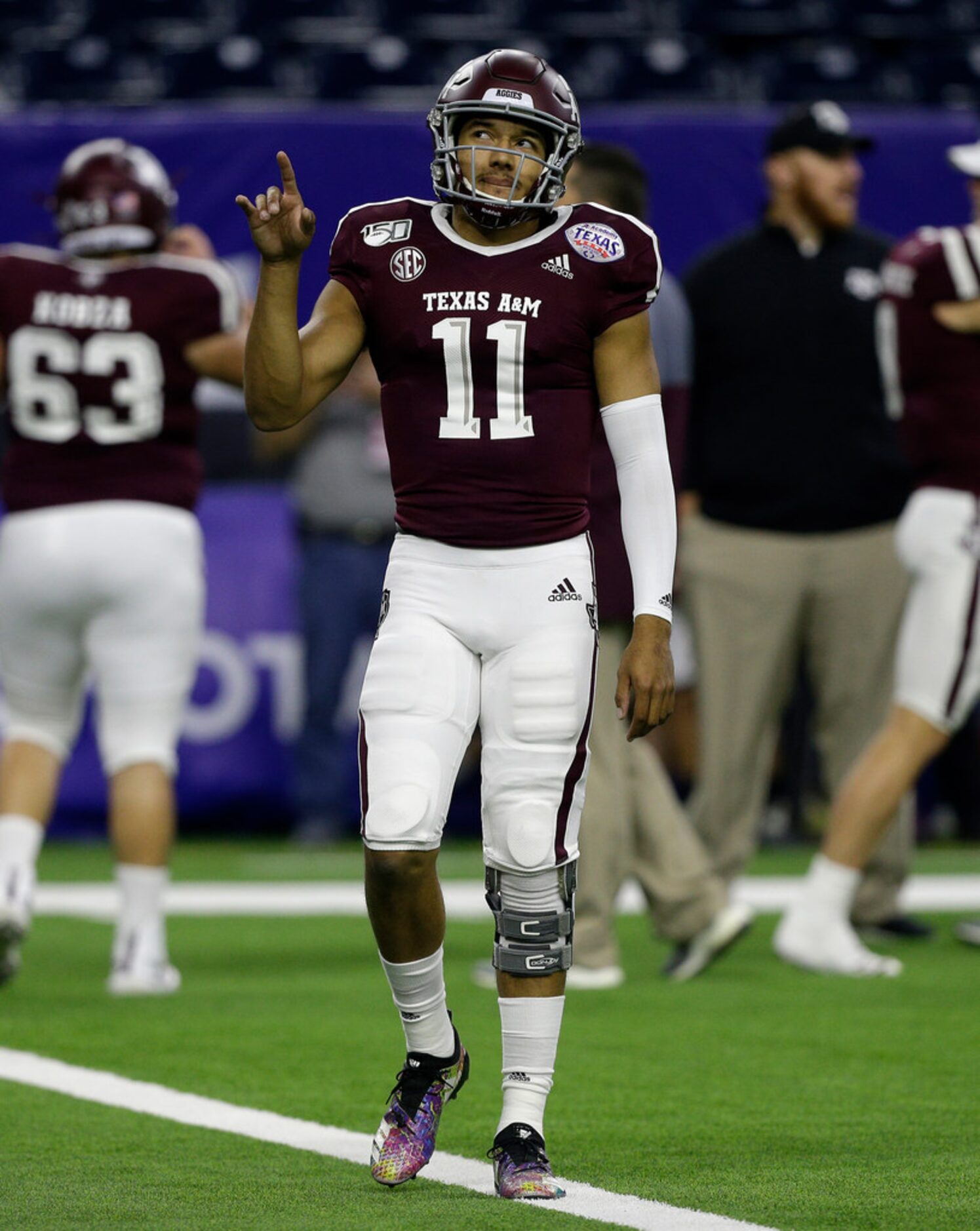 HOUSTON, TEXAS - DECEMBER 27: Kellen Mond #11 of the Texas A&M Aggies warms up before...