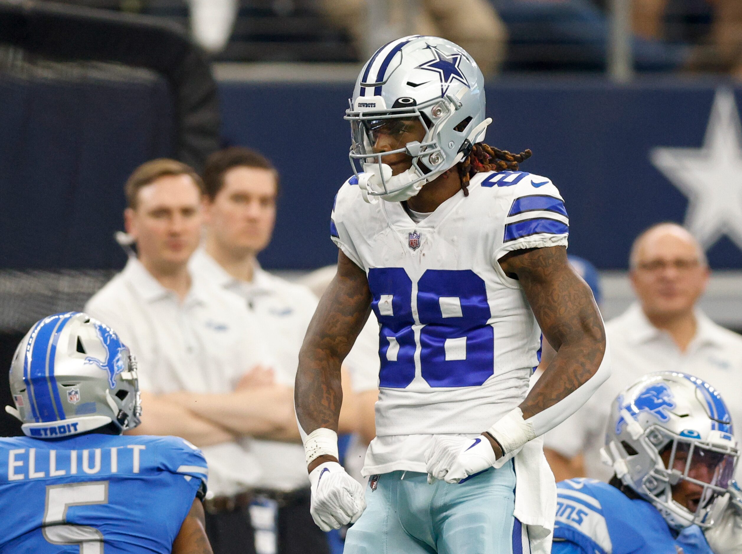 Dallas Cowboys wide receiver CeeDee Lamb (88) flexes after making a catch between Detroit...