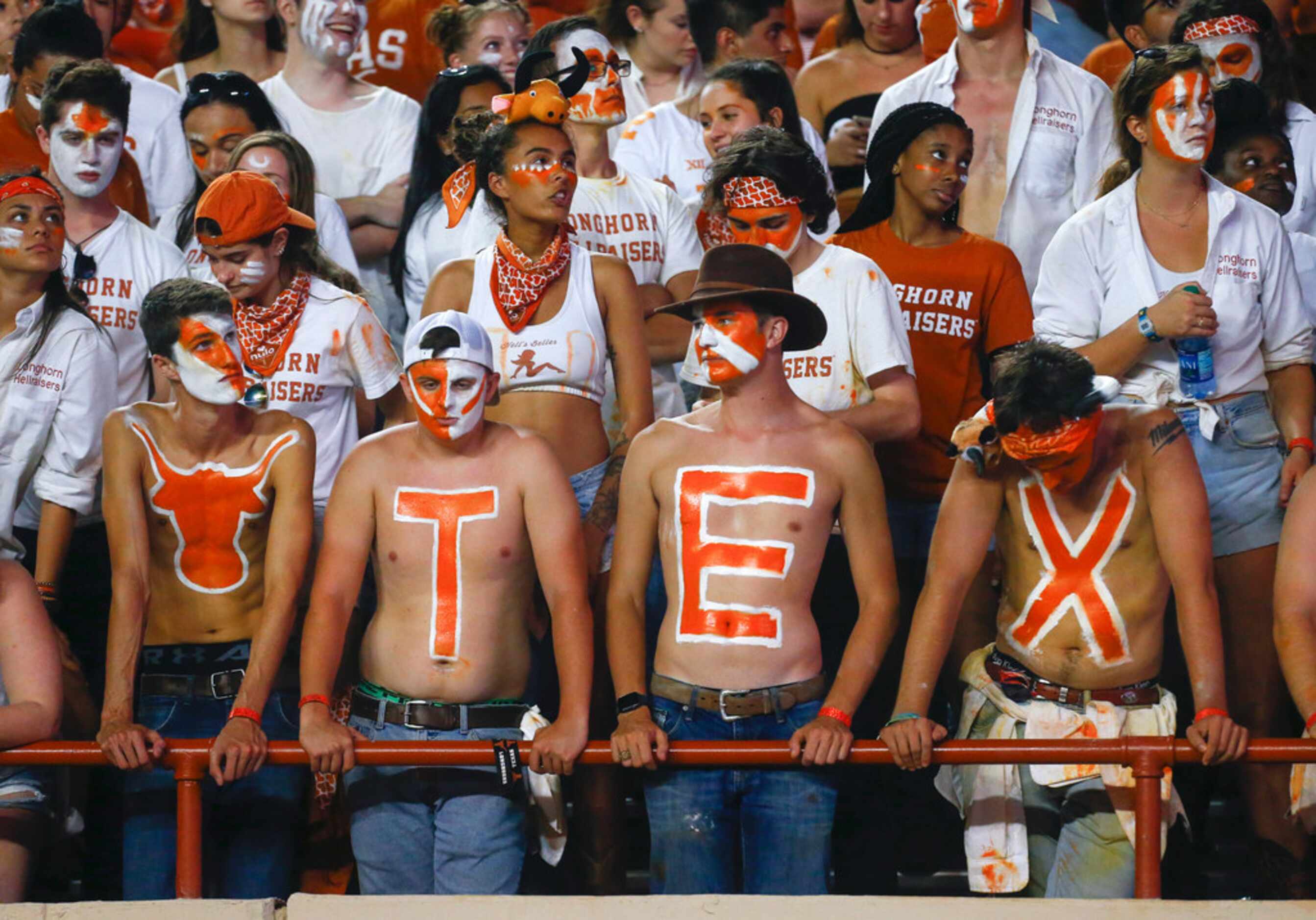 Texas fans react in the final minutes of Texas' loss to the LSU Tigers in a college football...