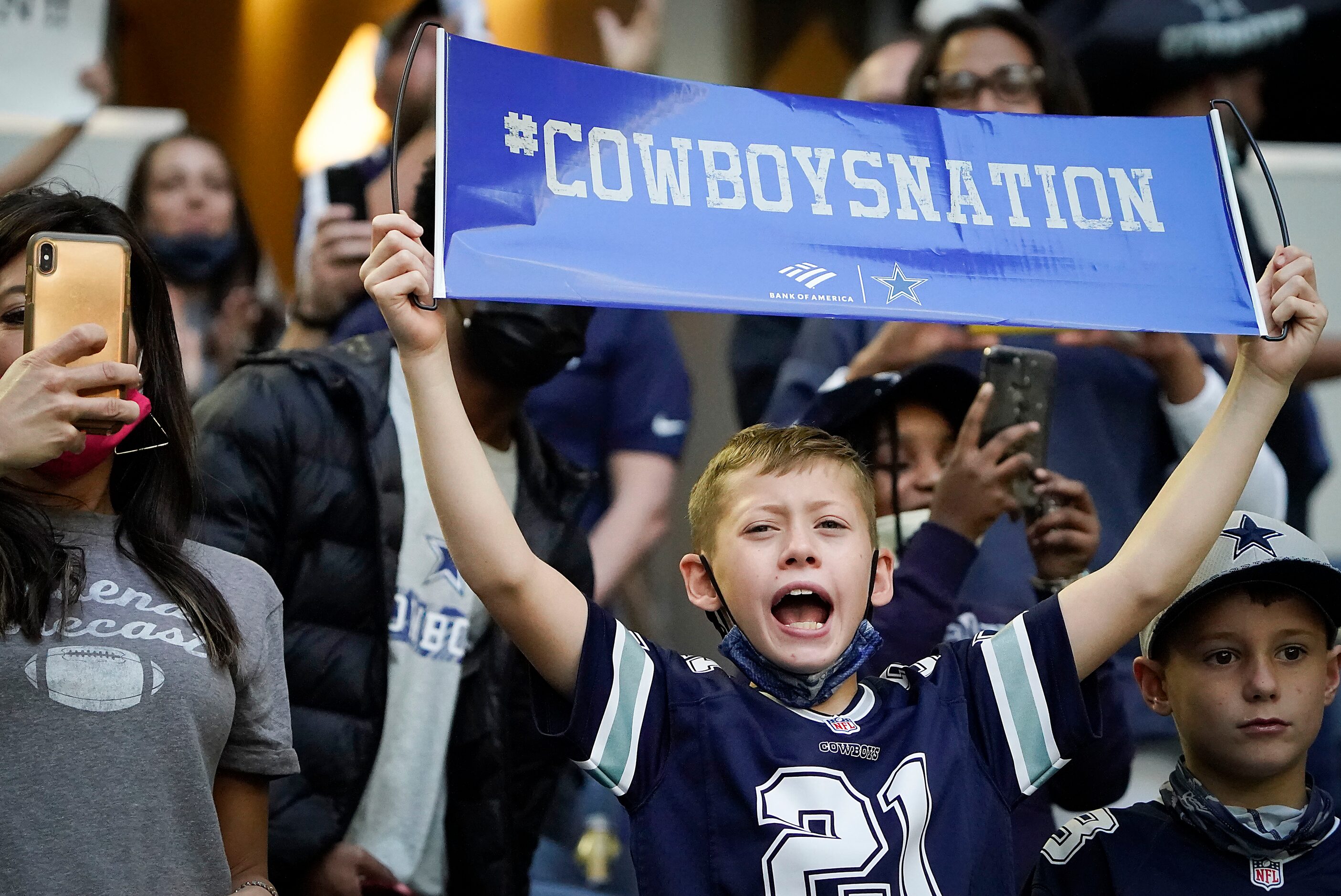 Dallas Cowboys fans cheer as their team takes the field to face the Philadelphia Eagles in...