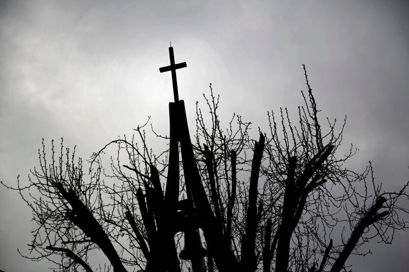 The cross atop St. Luke Catholic Church in Irving.