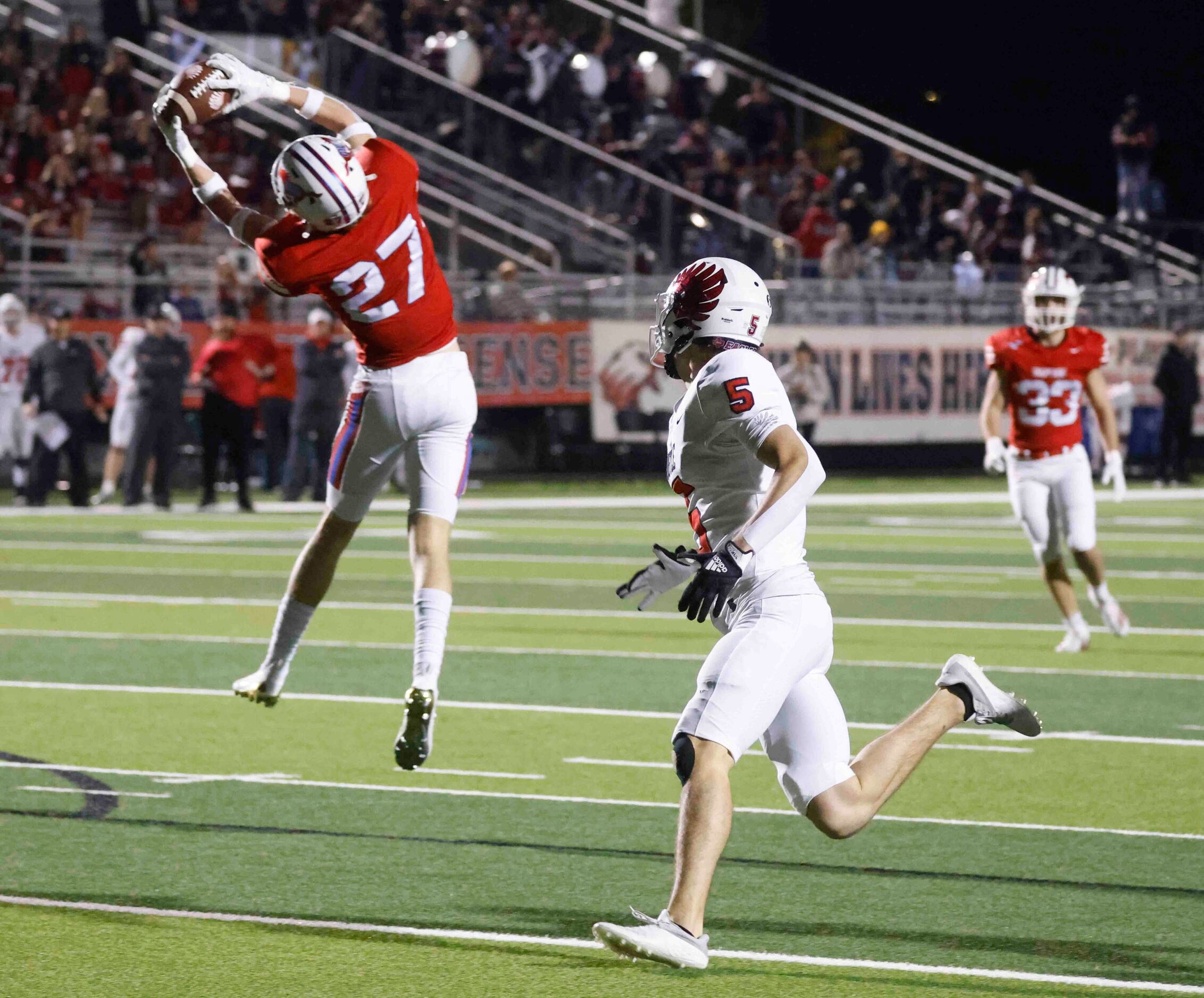 Grapevine High’s Drew Nelson (27), left, intercepts a pass intended for Argyle High’s Will...