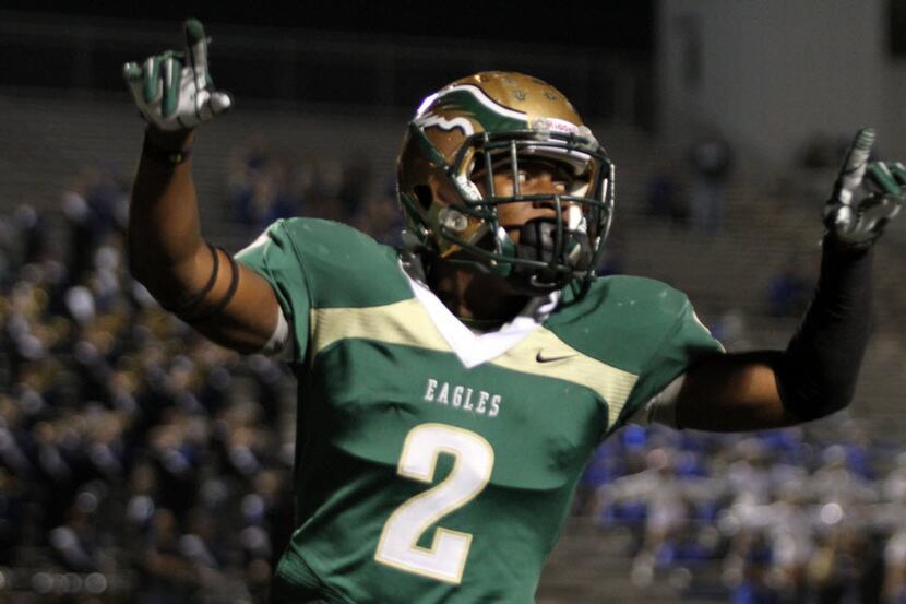 DeSoto Eagles running back Dontre Wilson (2) appears to be directing the roar from a...