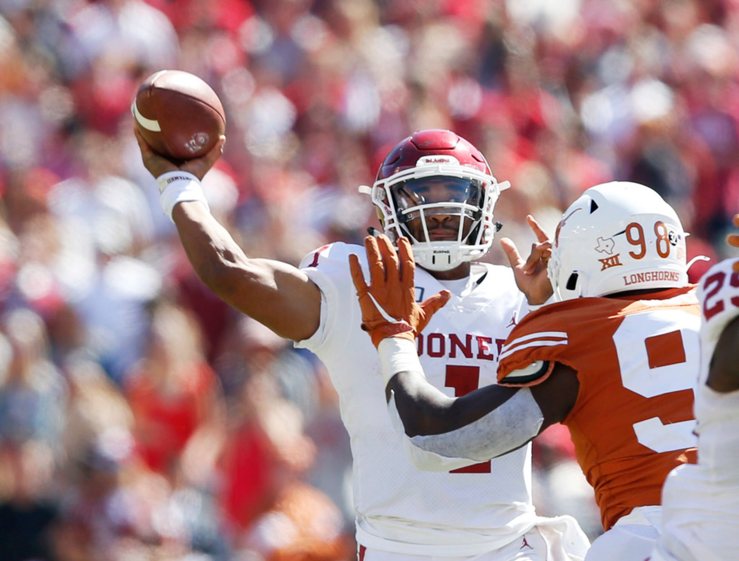 Oklahoma Sooners quarterback Jalen Hurts (1) attempts a pass as Texas Longhorns defensive...