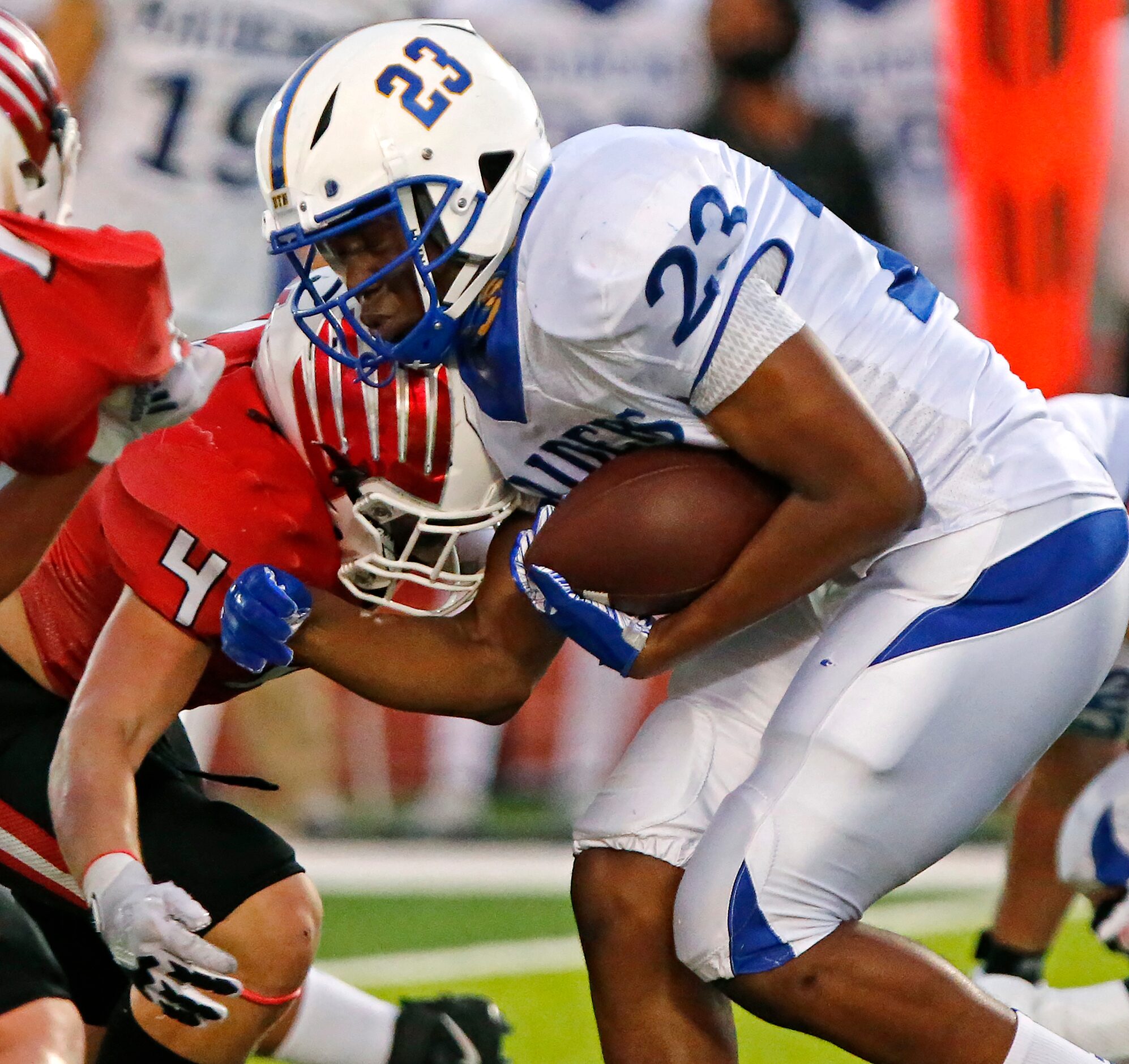 Sunnyvale High School running back Obi Arinze (23) is met by Melissa High School defensive...