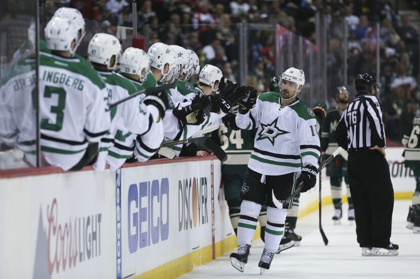 Dallas Stars left wing Patrick Sharp (10) celebrates the Stars' third goal during the first...