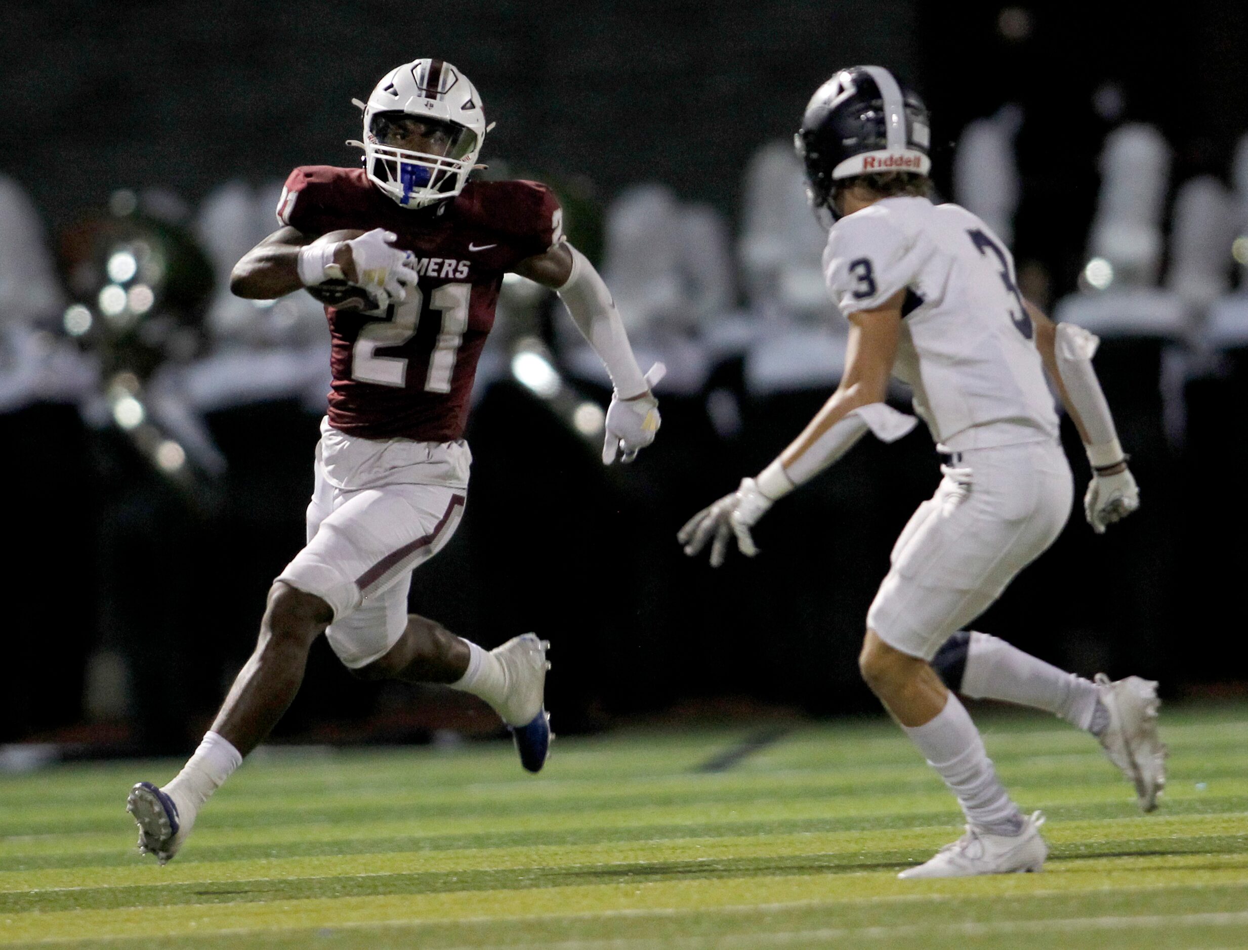 Lewisville running back Viron Ellison (21) rambles into the Flower Mound secondary as...