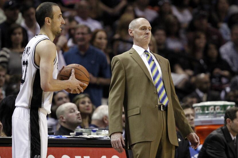Dallas Mavericks head coach Rick Carlisle leans back as San Antonio Spurs guard Manu...