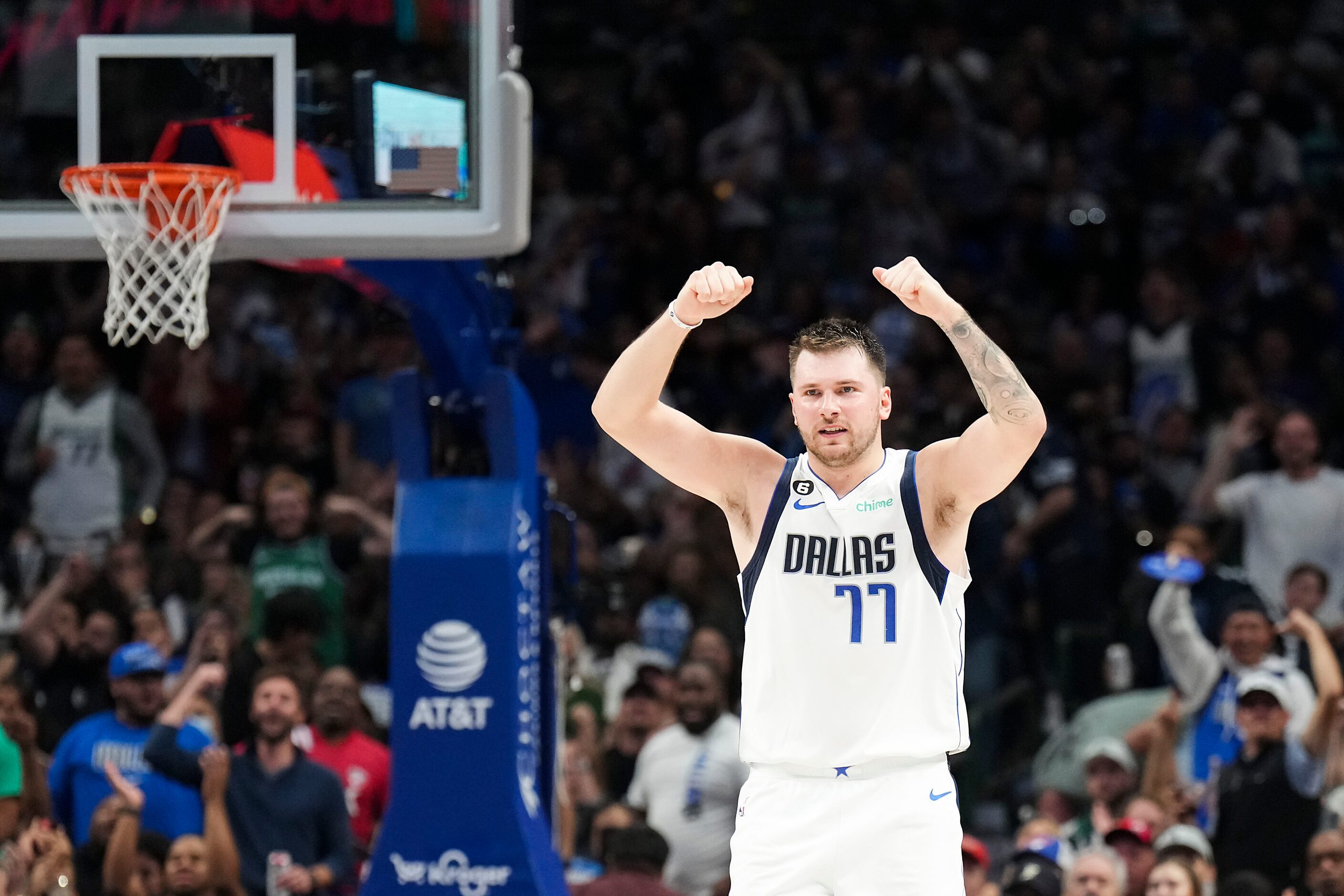 Dallas Mavericks guard Luka Doncic (77) celebrates a basket by Christian Wood during the...