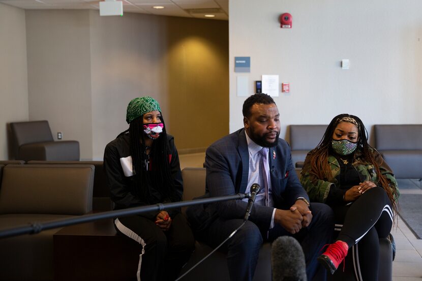 Lee Merritt, with Scott's cousin Denisha Curry (left) and sister LaChay Batts, took Collin...