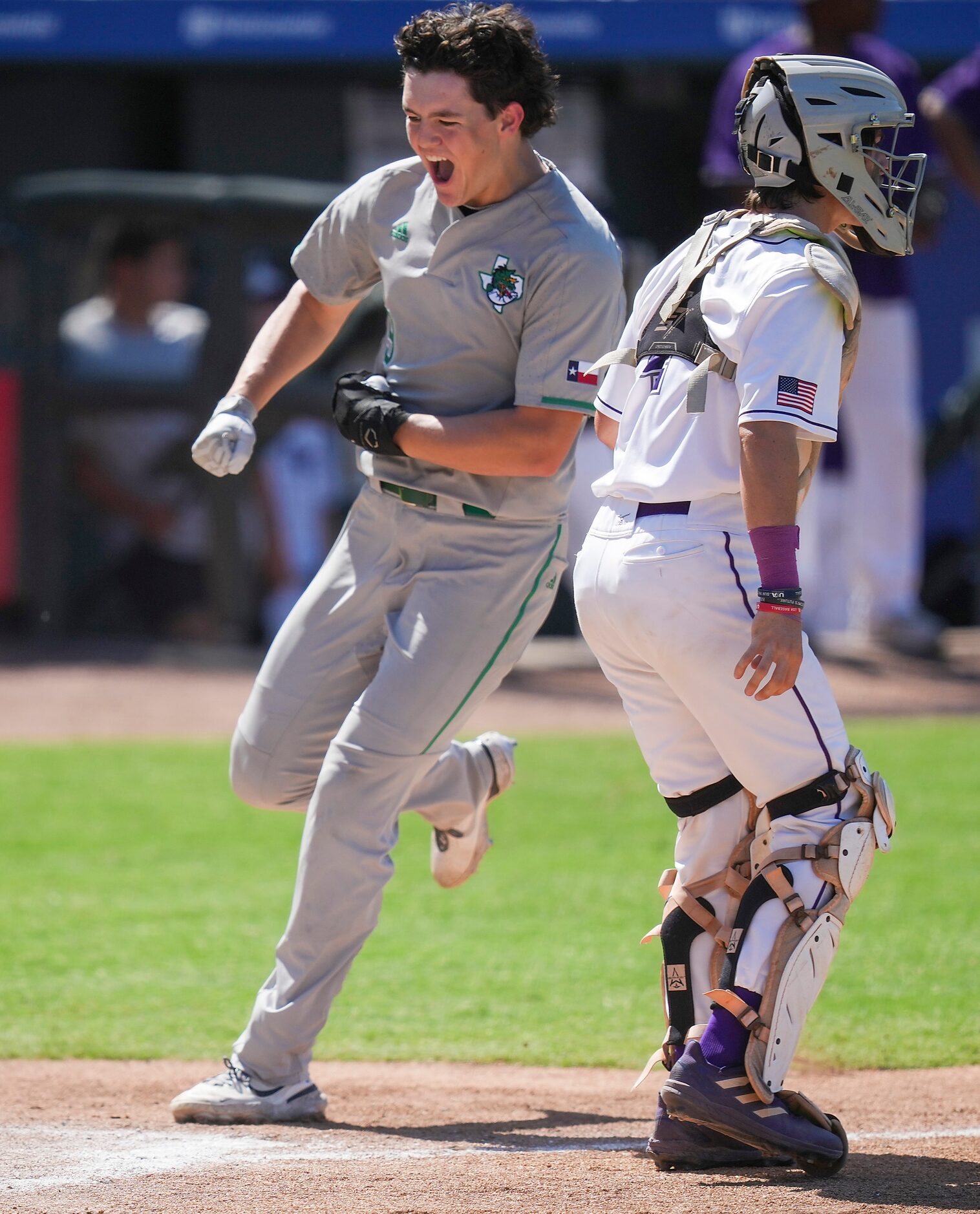 Southlake Carroll center fielder Owen Proksch celebrates as he scores past Fort Bend Ridge...