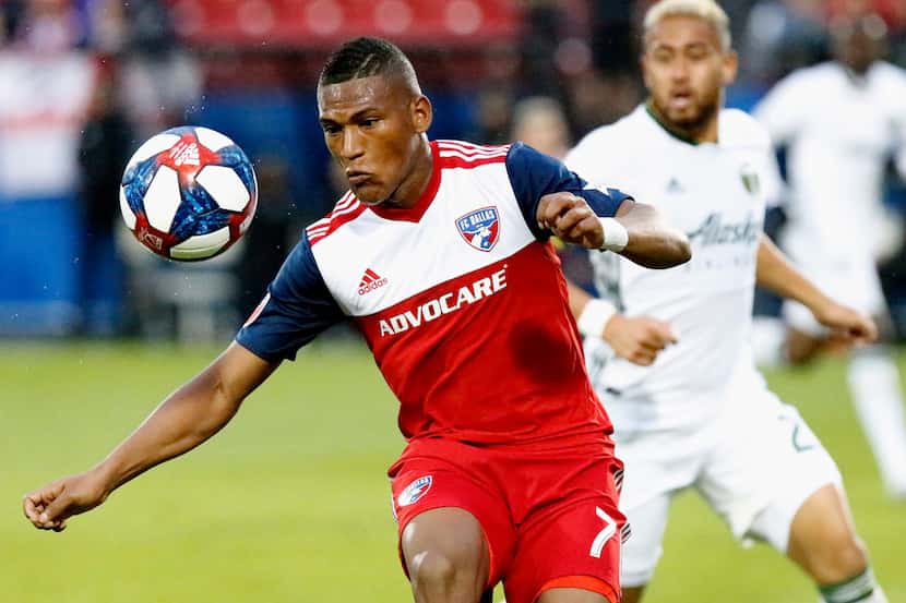 FC Dallas midfielder Carlos Gruezo (7) receives a pass in front of Portland Timbers defender...
