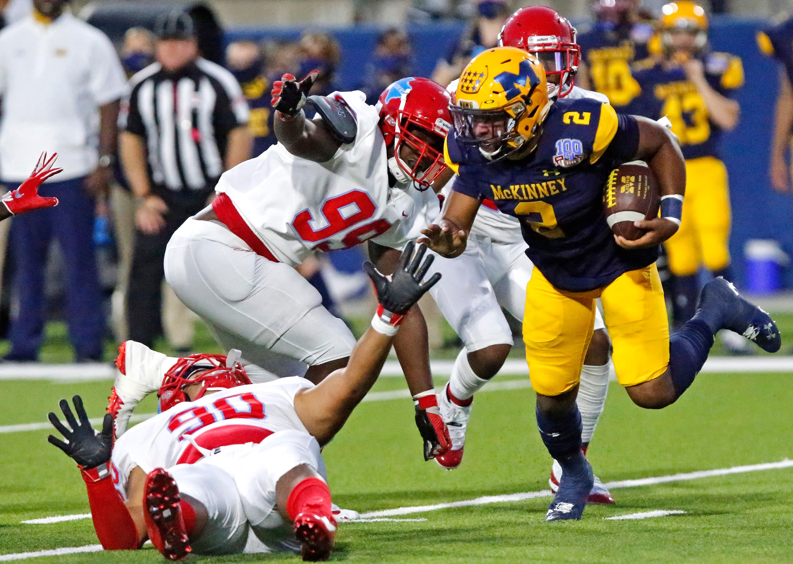 McKinney High School quarterback Ja’kobe Walton (2) scrambles past Skyline High School...