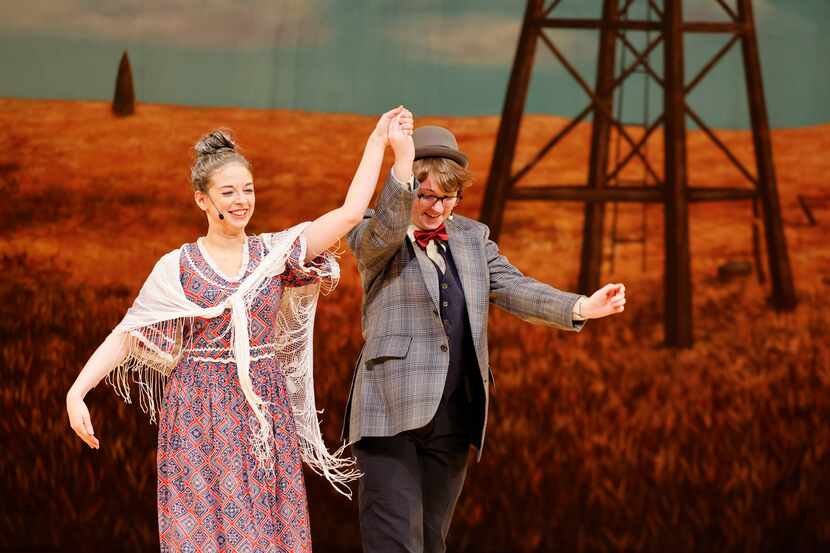 Cast members Kiersten Harston as Aunt Eller, and Max Hightower as Ali Hakim take a bow after...