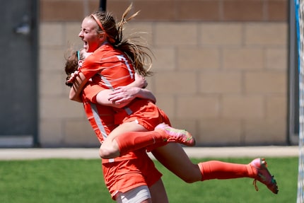 Celina midfielder Lexi Tuite (7) leaps into the arms of Celina forward Taylor Zdrojewski...