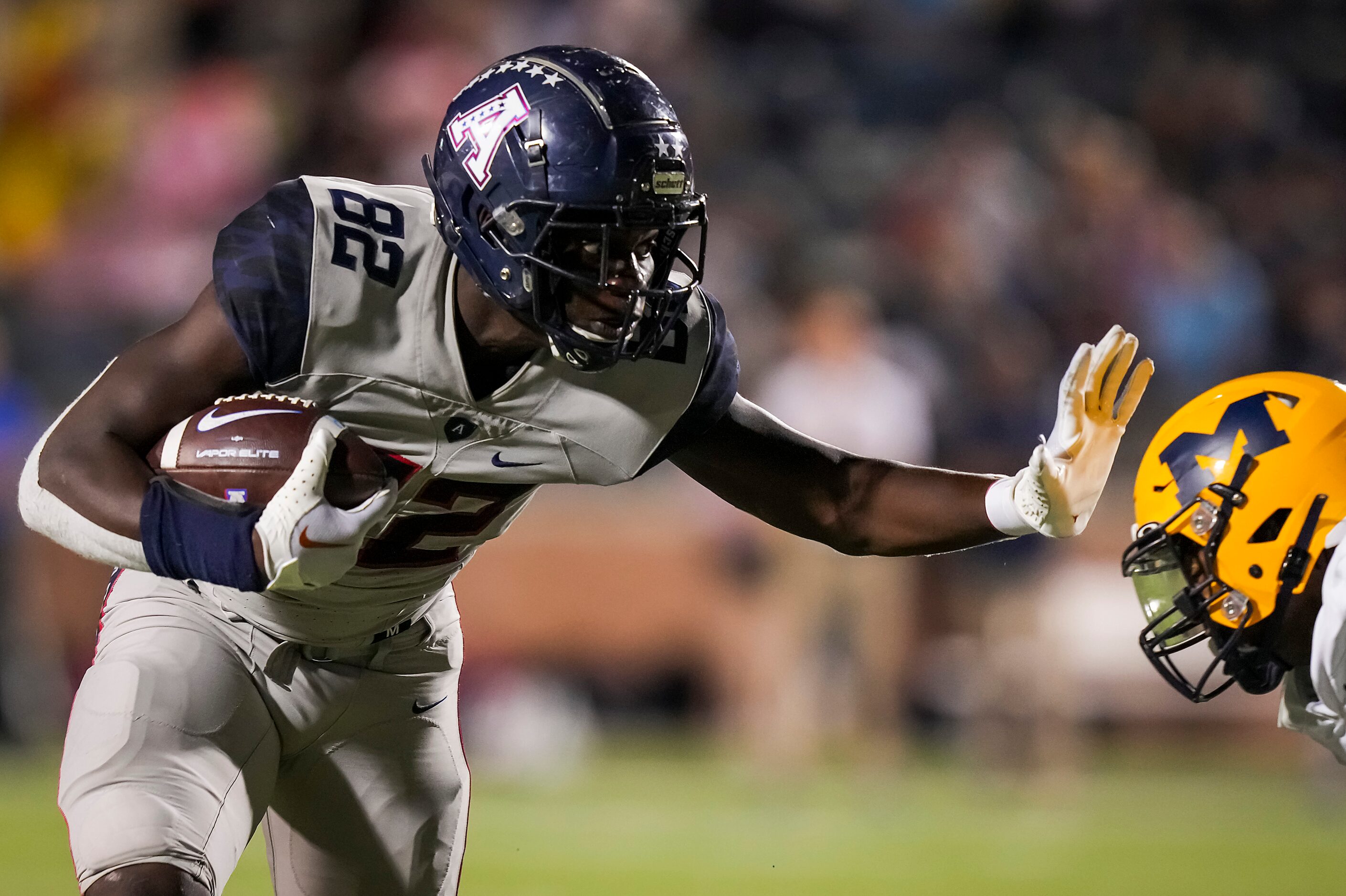 Allen wide receiver Davon Mitchell (82) pushes away from McKinney defensive back Christian...