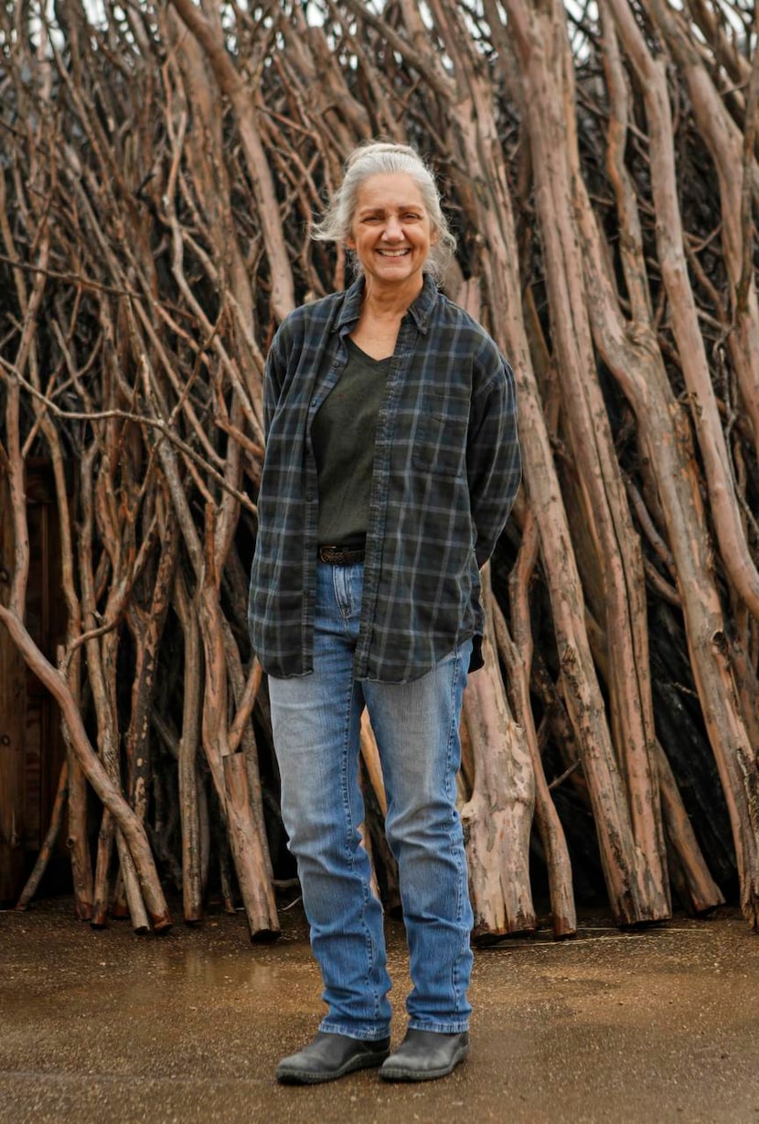 
Dallas artist Sherry Owens poses outside her studio in an industrial neighborhood that...