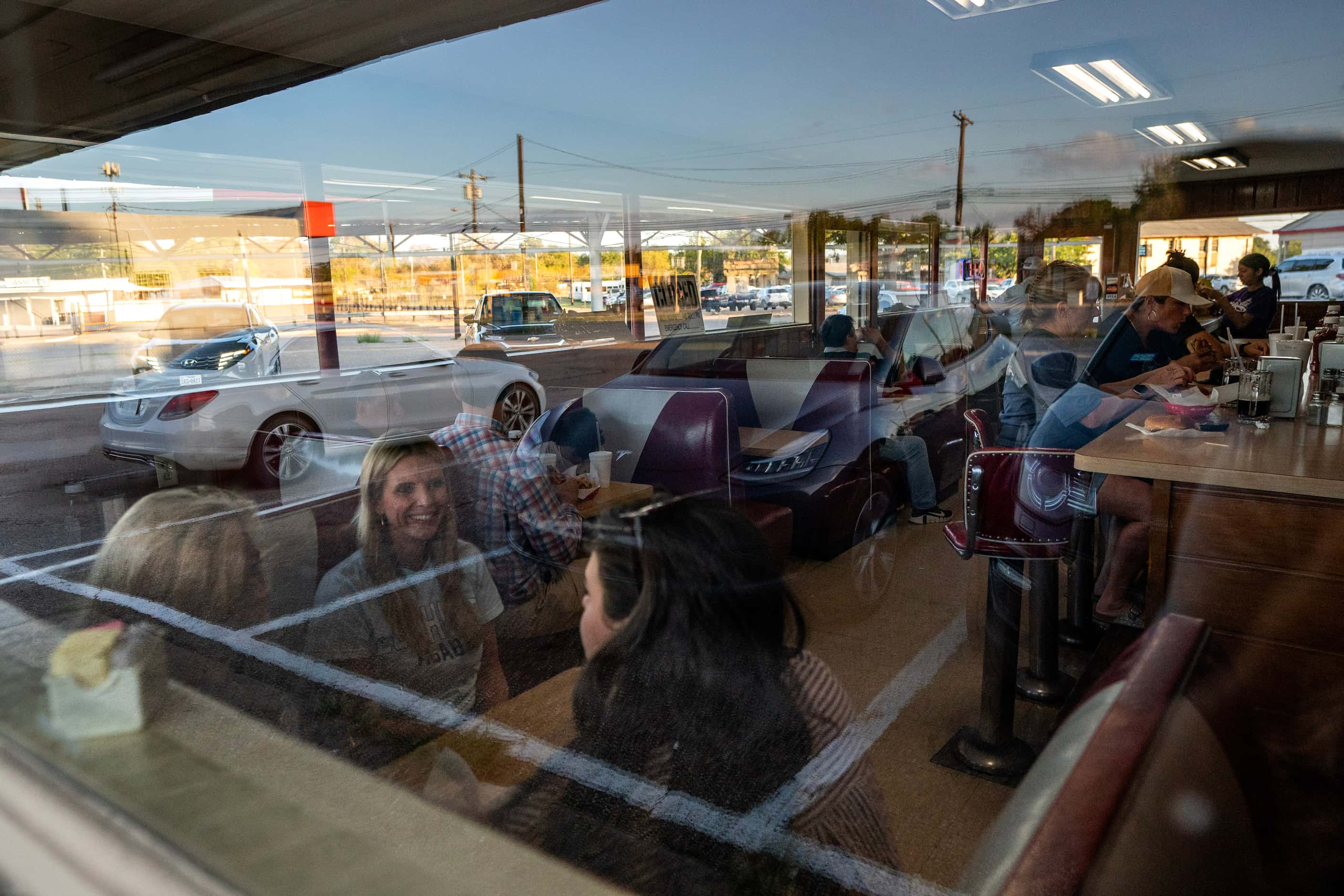 Argyle Liberty Christian fans dine at Dairy-Ette, a 1950s style diner across the street from...
