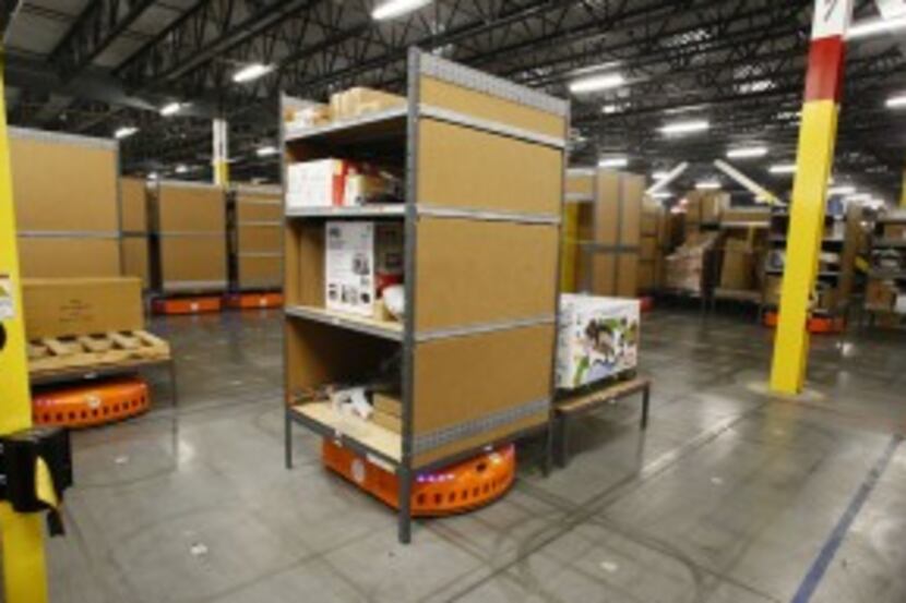  A pick-mod by Amazon robotics move around shelves a the Amazon.com fulfillment center in...