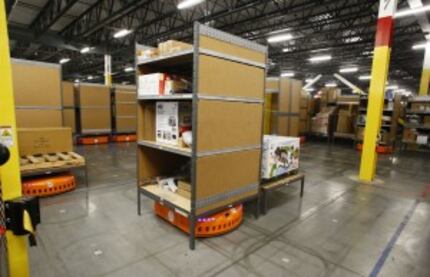  A pick-mod by Amazon robotics move around shelves a the Amazon.com fulfillment center in...