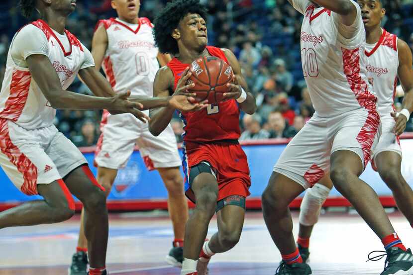 Duncanville's Ja'Bryant Hill #2 drives the lane. UIL boys basketball 6A State semi-final...