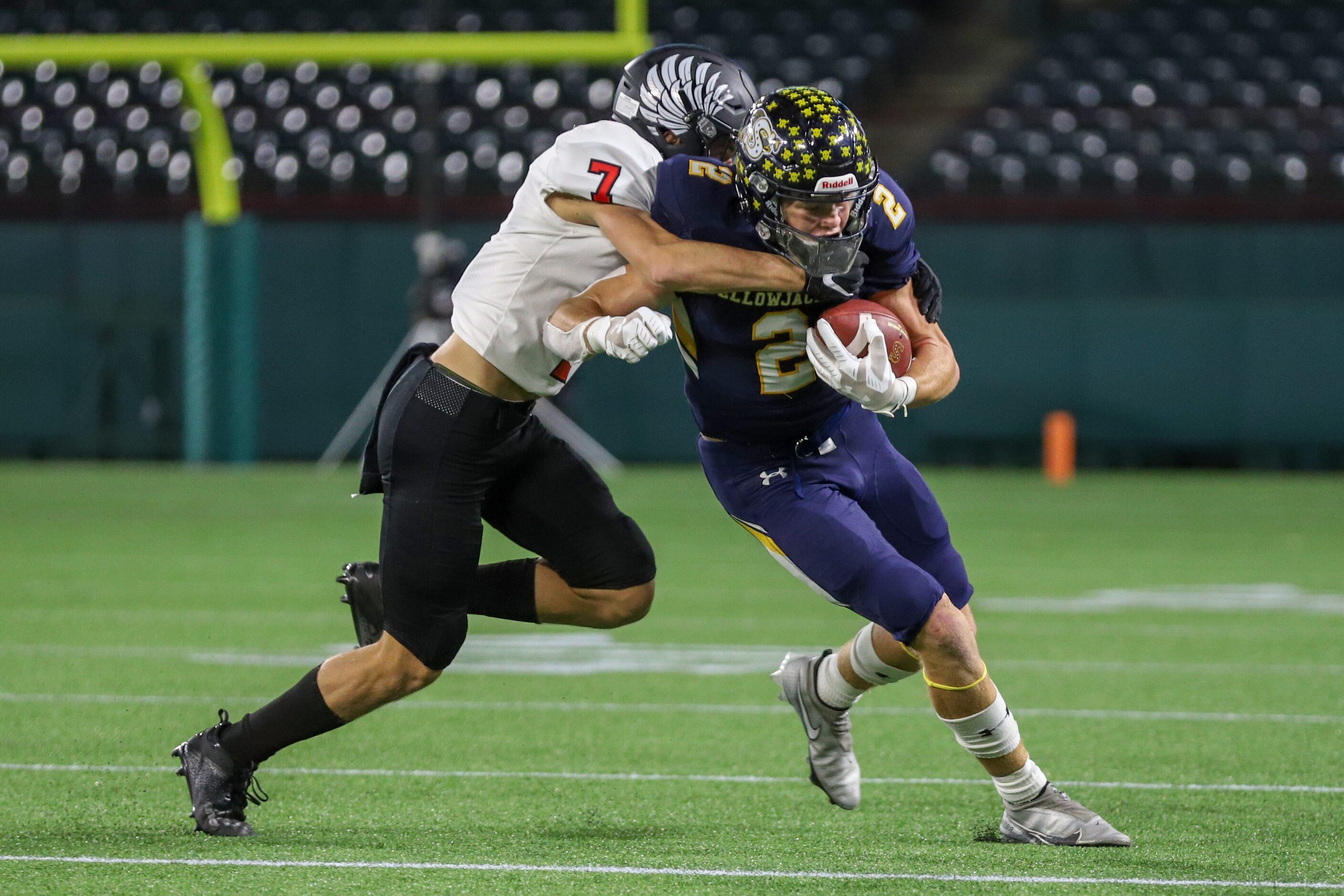 Argyle defensive back Jett Copeland (7) tackles Stephenville wide receiver Coy Eakin (2)...