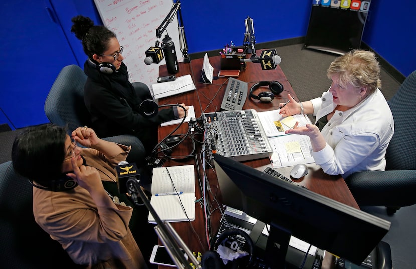 Charlise Hill-Larson (right), a former United Methodist minister, talks with her...