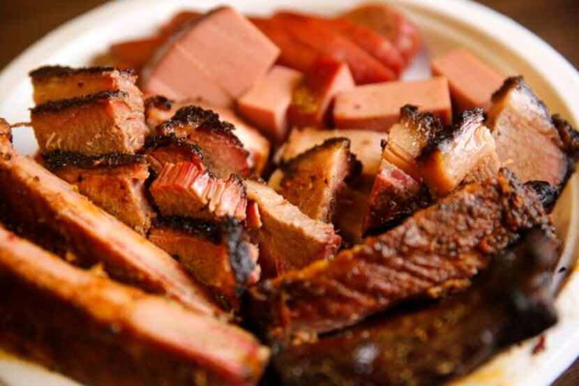 
Plates full of smoked brisket, ribs sausage and even bologna are served up at Lazy S&M BBQ...