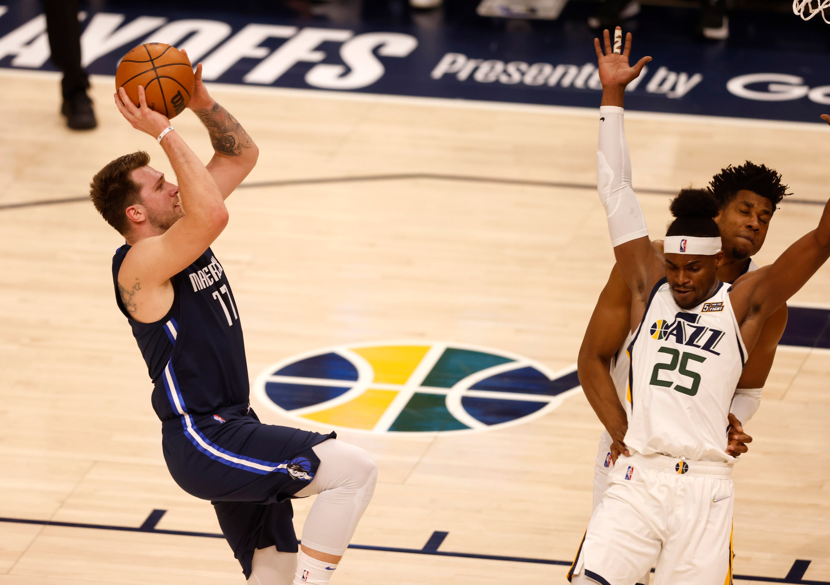 Dallas Mavericks guard Luka Doncic (77) attempts a shot as Utah Jazz forward Danuel House...