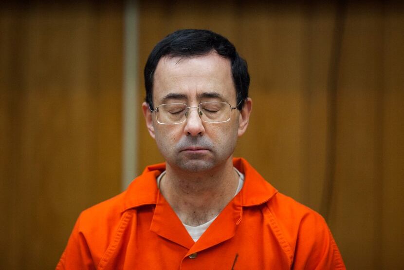 In this Feb. 5, 2018, file photo, Larry Nassar listens during his sentencing at Eaton...