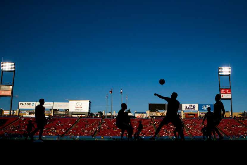 FC Dallas players warm up before an MLS game between FC Dallas and Houston Dynamo on Sunday,...