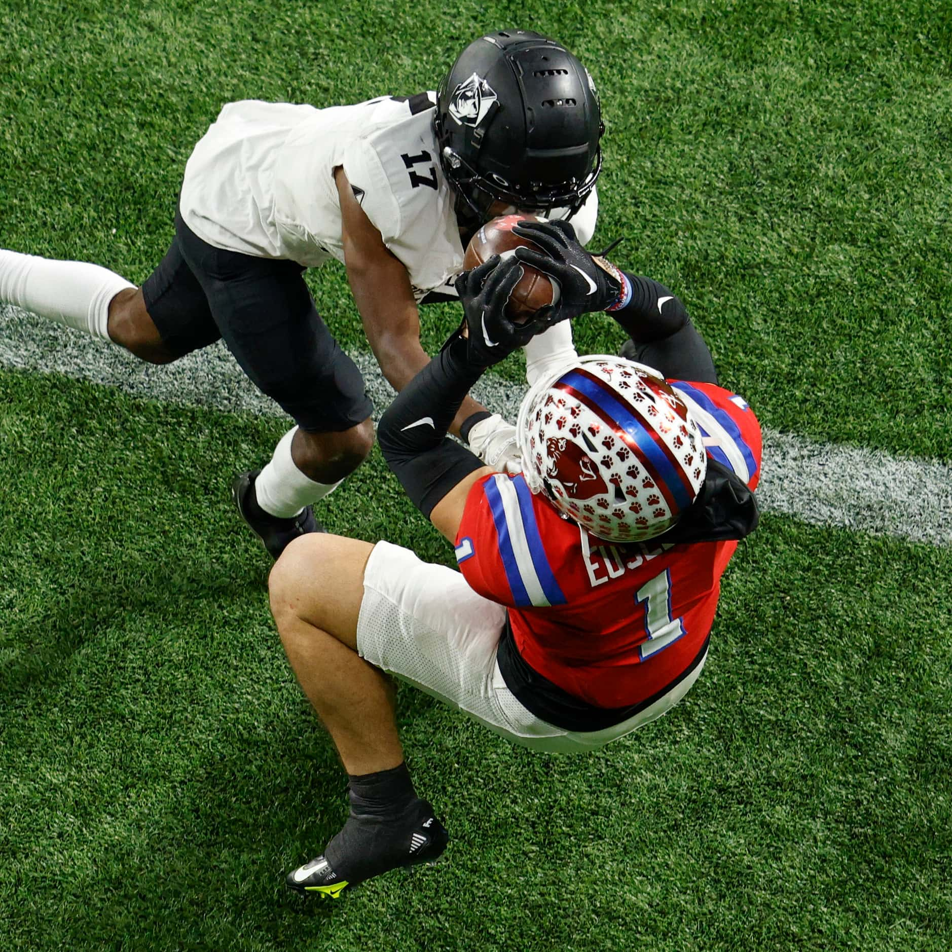 Parish Episcopal wide receiver Derek Eusebio (1) makes a leaping catch over Bishop Lynch's...