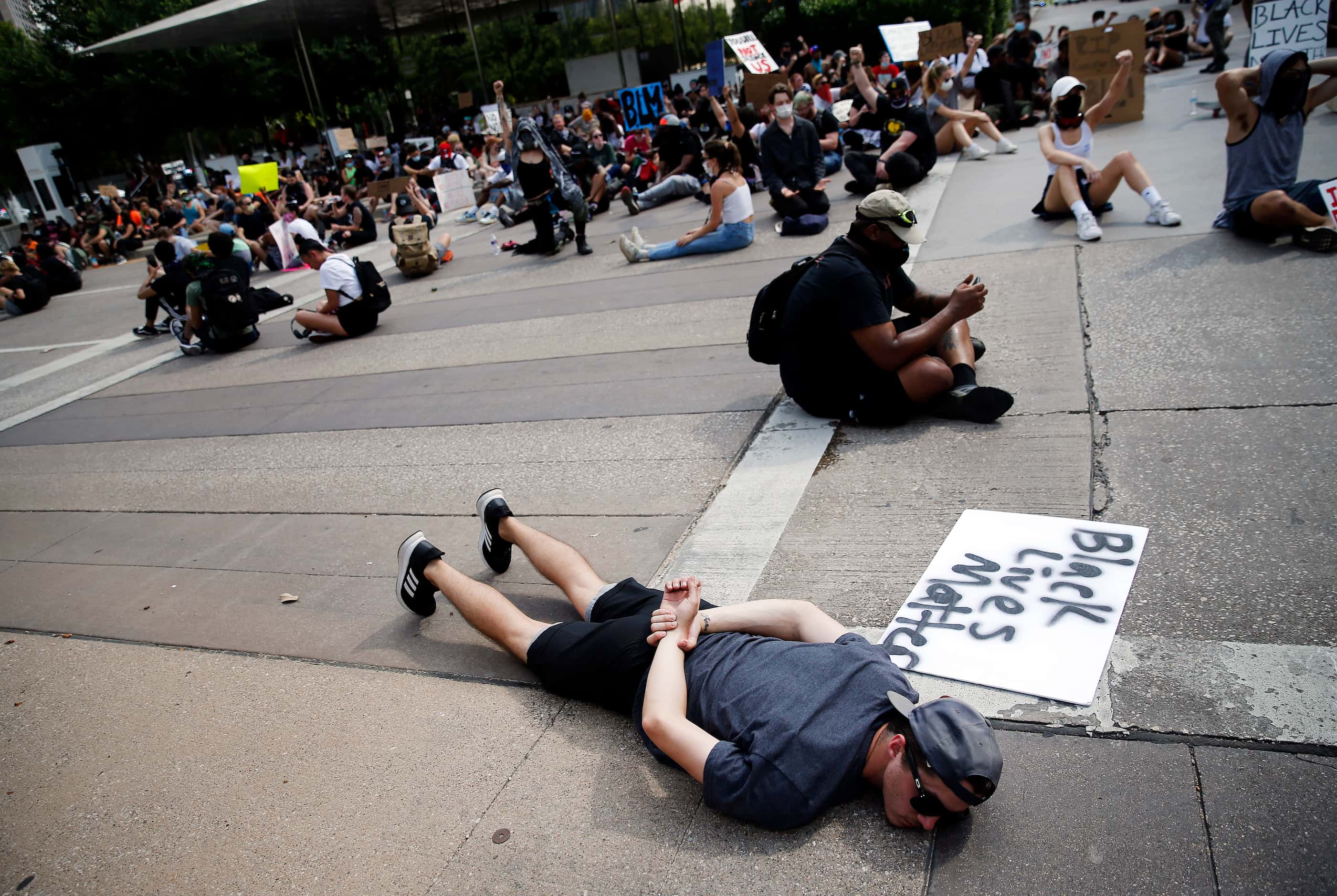 Protestors supporting Black Lives Matters block an intersection at Klyde Warren Park for 8...