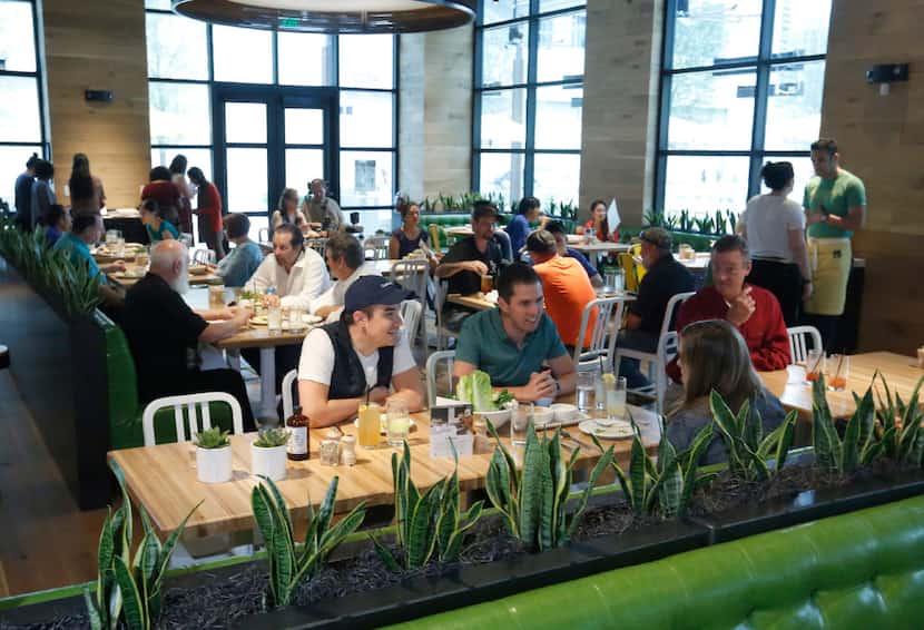 The lunch crowd starts to fill True Food Kitchen at Legacy West in Plano on a Friday in May...
