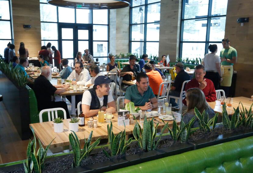 The lunch crowd starts to fill True Food Kitchen at Legacy West in Plano on a Friday in May...