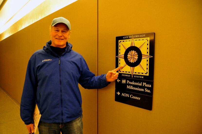 Tour guide Richard Zieman points out Pedway markers used to navigate through the underground...