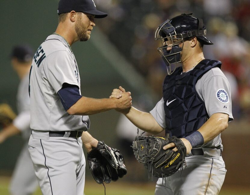 Seattle Mariners relief pitcher Tom Wilhelmsen (54) and catcher Mike Zunino (3) celebrate...