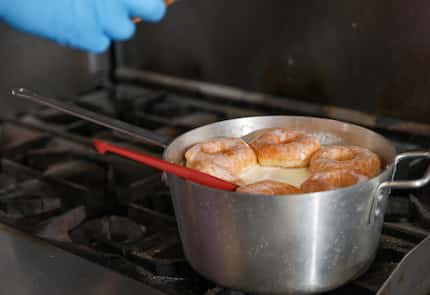 Will Gibson soaks donuts in an ice cream base to absorb the flavor and sweetness. All of...