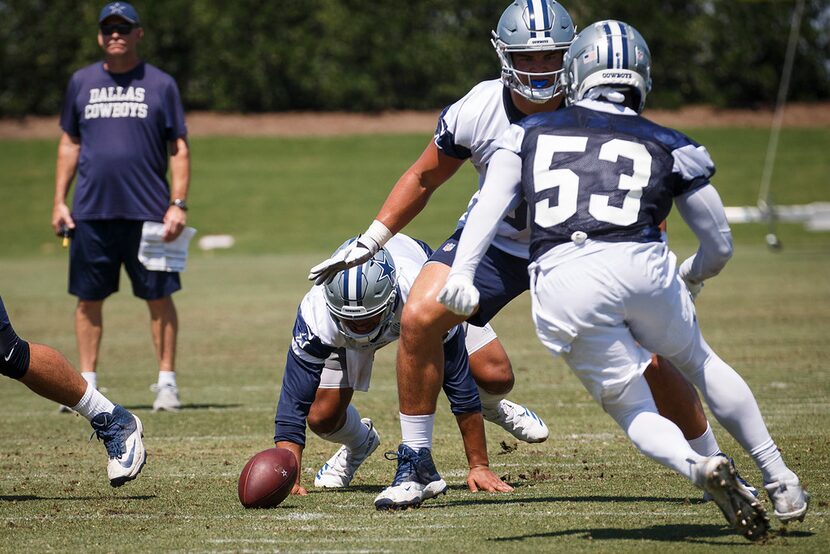 Dallas Cowboys quarterback Dak Prescott (4) fumbles a snap that was recovered by linebacker...